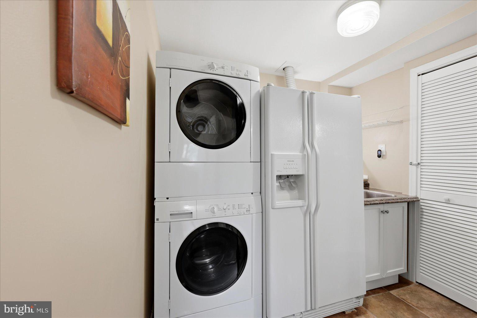 10929 Howland Drive Reston, VA 20191 - Photo 40 of 66 a view of a hallway with washer and dryer