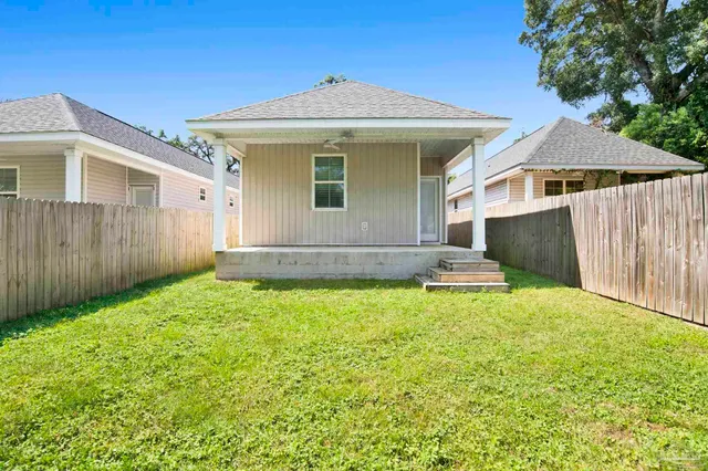 a front view of a house with yard