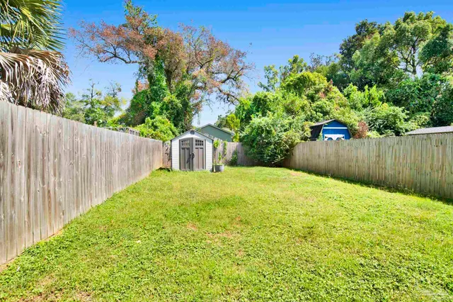 a backyard of a house with lots of green space