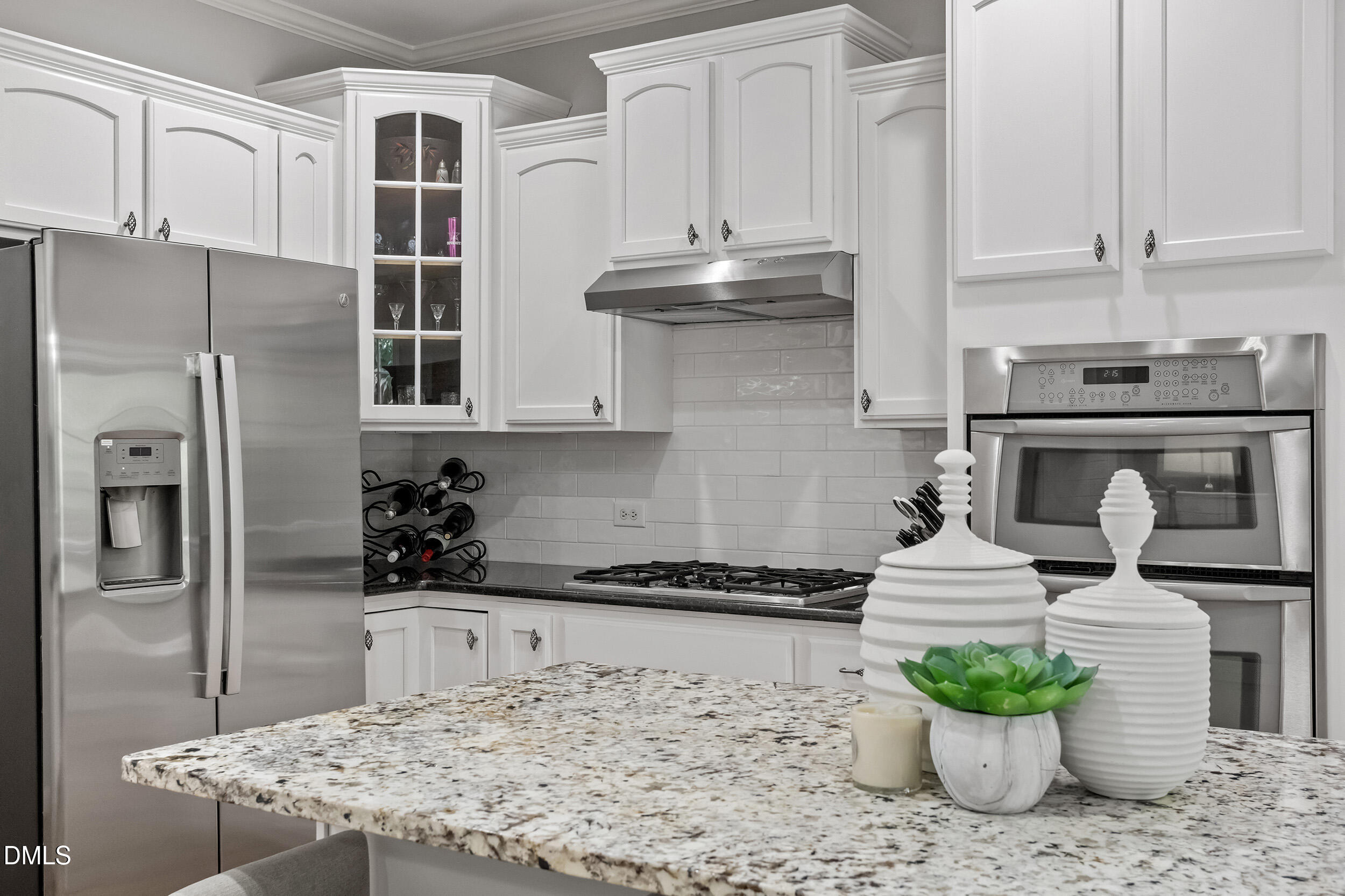 1019 Bianco Drive Raleigh, NC 27607 - Photo 13 of 29 a kitchen with stainless steel appliances granite countertop a refrigerator and a stove