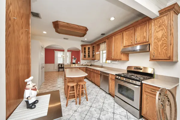a bedroom with a large bed and a large window