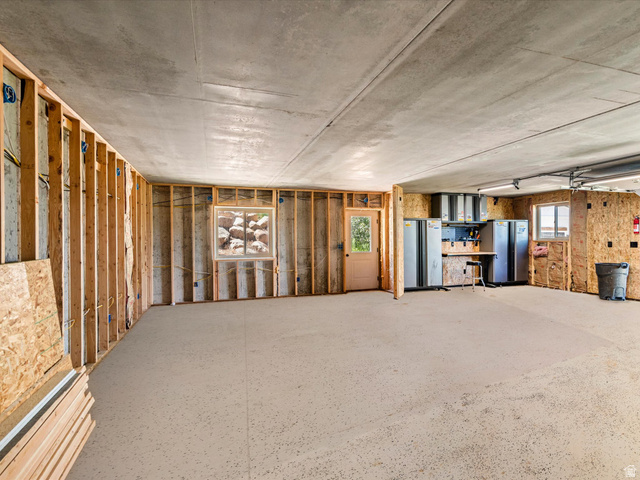 1225 Old Oregon Road Soda Springs, ID 83276 - Photo 52 of 67 Unfinished interior space featuring exposed wood framing, a concrete ceiling, and a light-toned, speckled floor finish