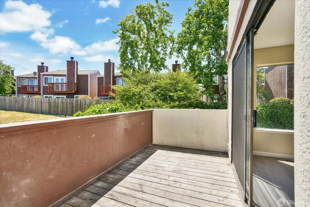 a view of an empty room with window and closet