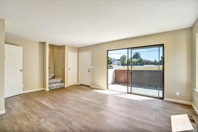 an empty room with sliding door