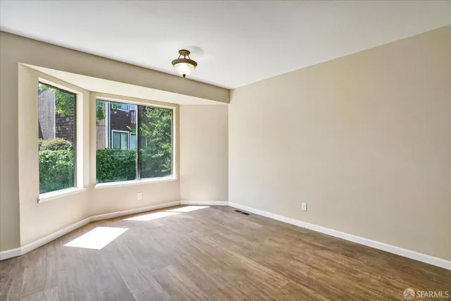 a kitchen with sink a stove and cabinets