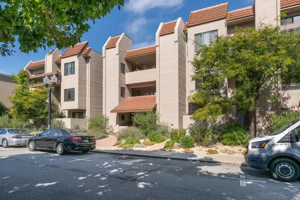 a view of a street with cars