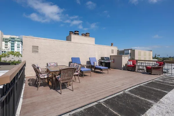 a view of a terrace with furniture and stove