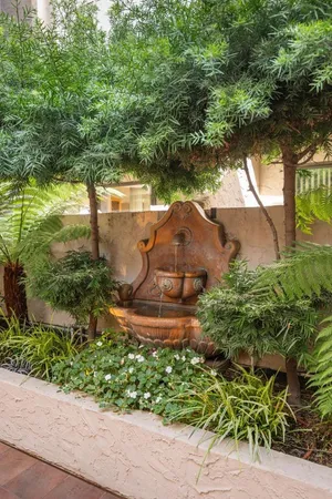 an aerial view of a house with garden space and street view