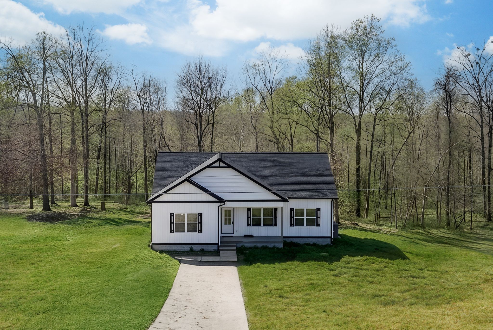 a aerial view of a house with a big yard