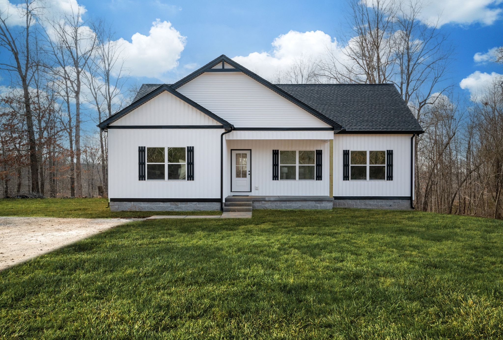 3033 Bowker Road Charlotte, TN 37036 - Photo 2 of 30 a backyard of a house with table and chairs