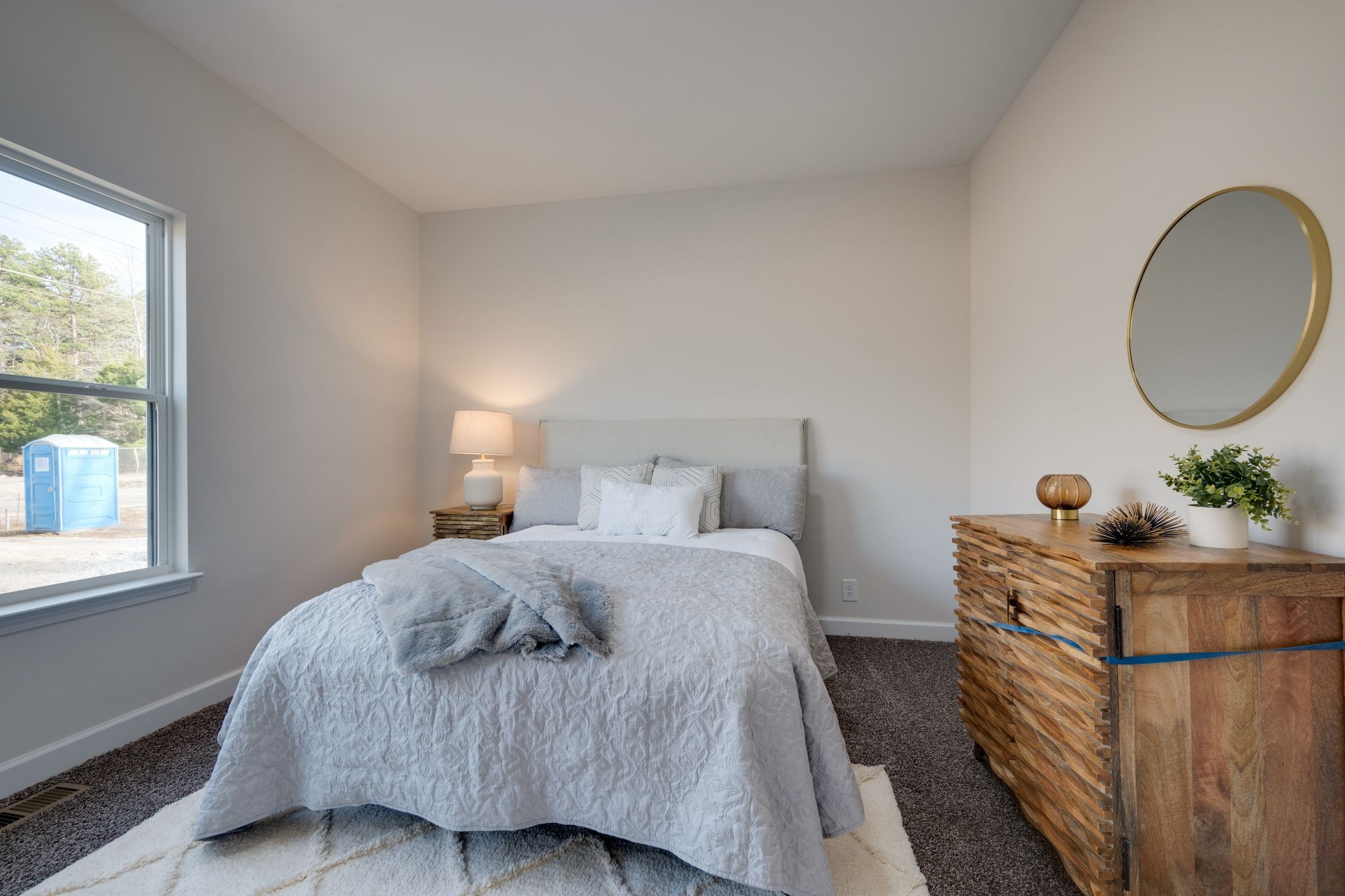 3033 Bowker Road Charlotte, TN 37036 - Photo 21 of 30 a bedroom with a bed table closet and a window