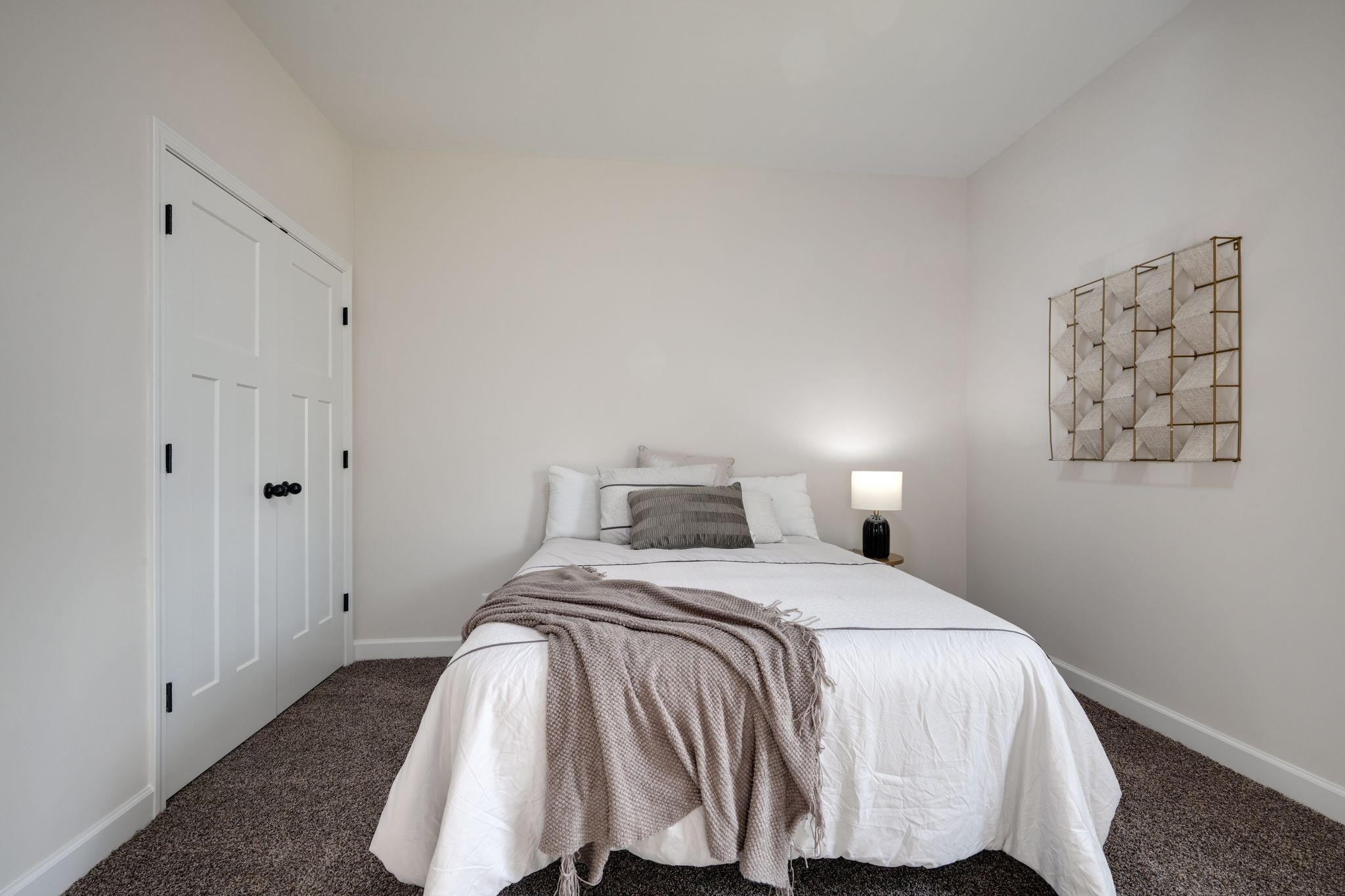 3033 Bowker Road Charlotte, TN 37036 - Photo 23 of 30 a bedroom with a bed and a lamp