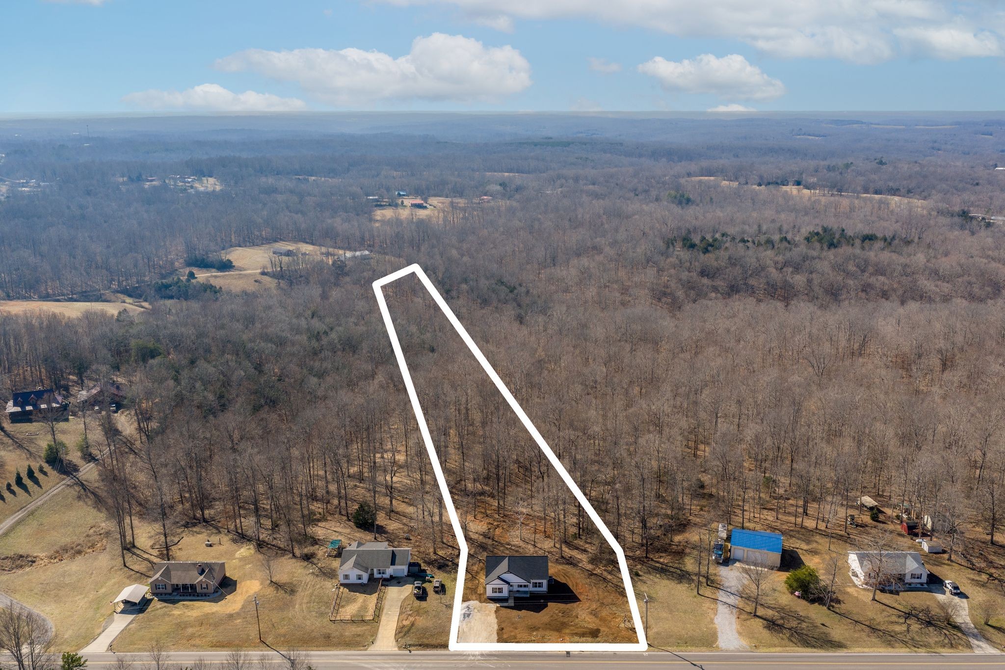 3033 Bowker Road Charlotte, TN 37036 - Photo 30 of 30 a view of roof with wooden floor and a potted plant