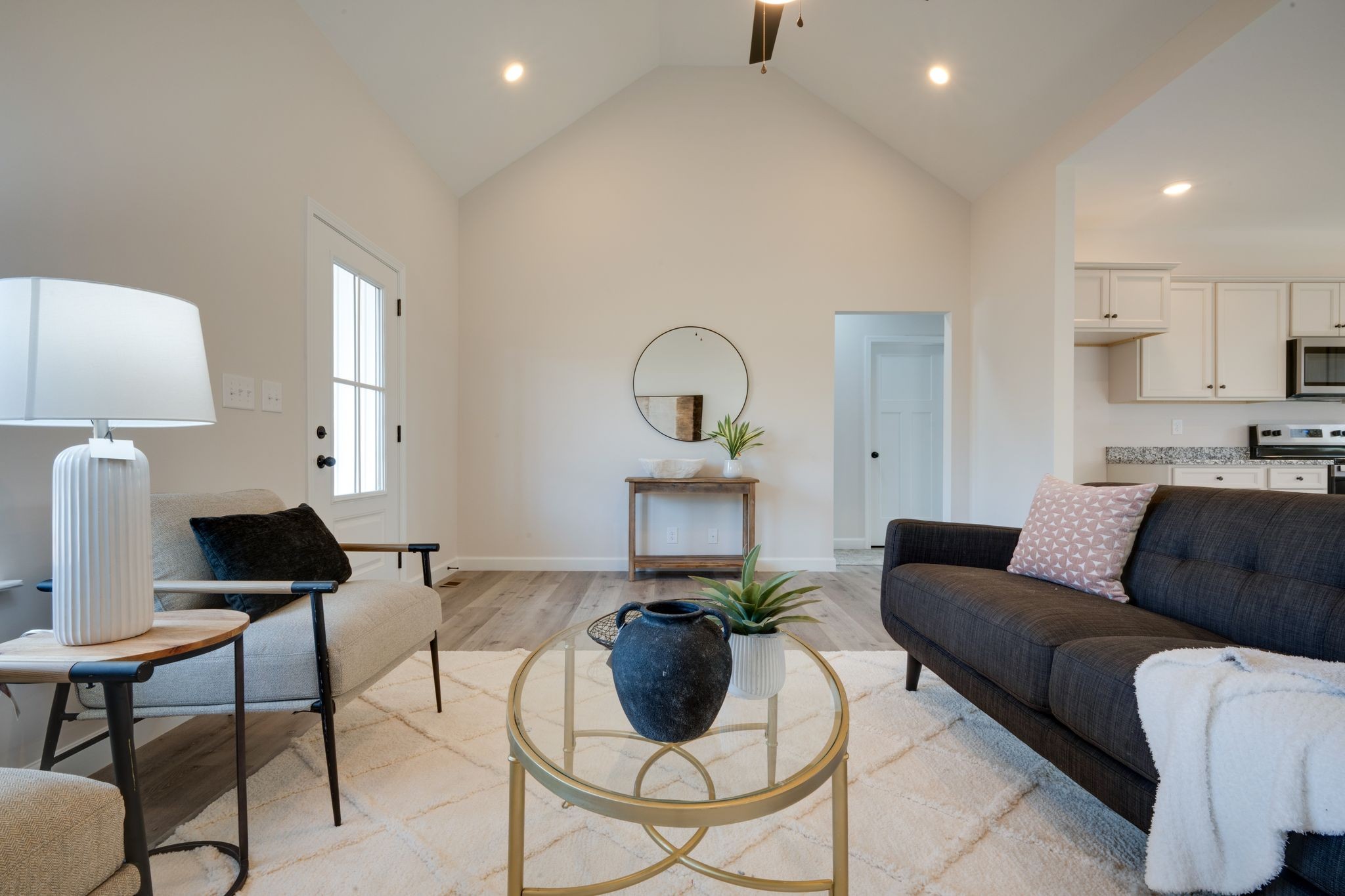 3033 Bowker Road Charlotte, TN 37036 - Photo 6 of 30 a living room with furniture a rug and a lamp