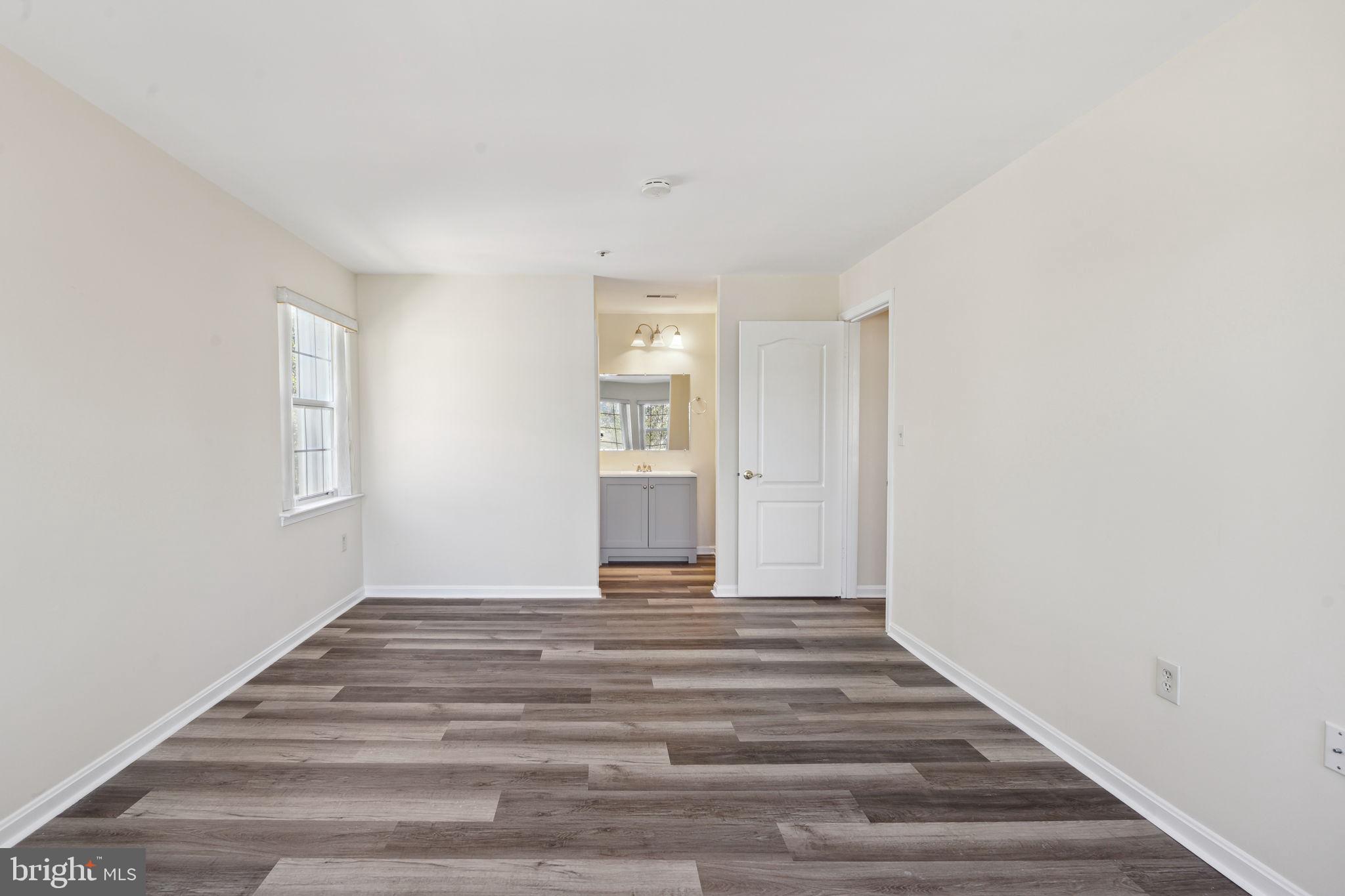 8381 Montgomery Run Road, Unit E Ellicott City, MD 21043 - Photo 18 of 31 Primary bedroom