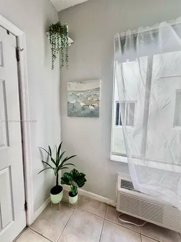 a white bath tub sitting next to a white tub