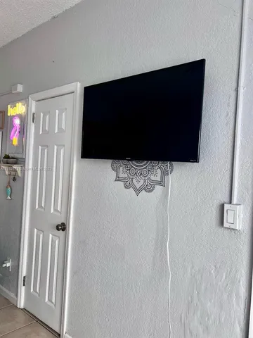 a view of a livingroom with a flat screen tv