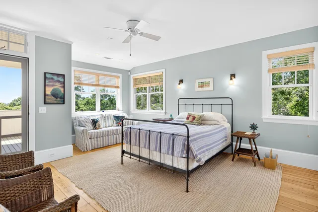 a bed room with a bed and a chair