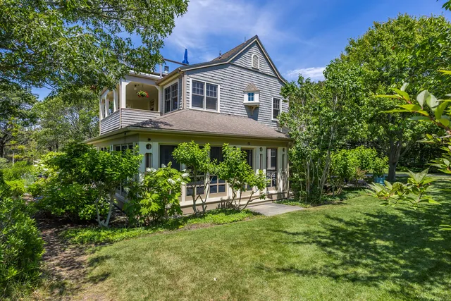 a view of a chair and table on the roof deck