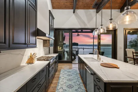 a kitchen that has a lot of cabinets