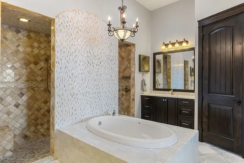 a living room with furniture a window and a chandelier