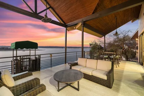 a view of a terrace with couches and pool