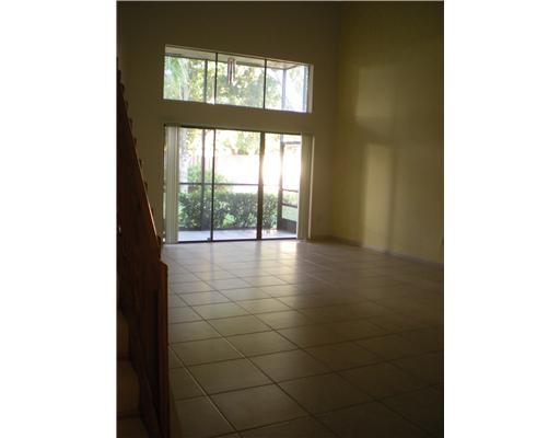 763 St Albans Drive, Unit 19 Boca Raton, FL 33486 - Photo 3 of 7 a view of an empty room with a floor to ceiling window