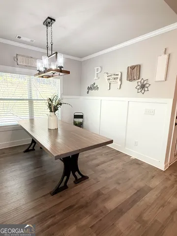 a view of a dining room with furniture