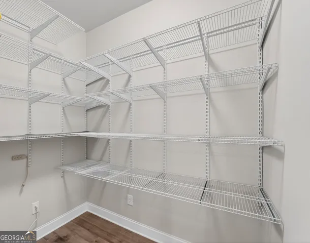 a view of a room with racks on the wall