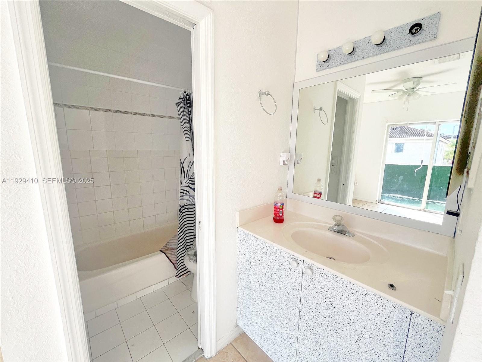 220 East 4th Street, Unit 3 Hialeah, FL 33010 - Photo 13 of 22 a bathroom with a tub sink and shower