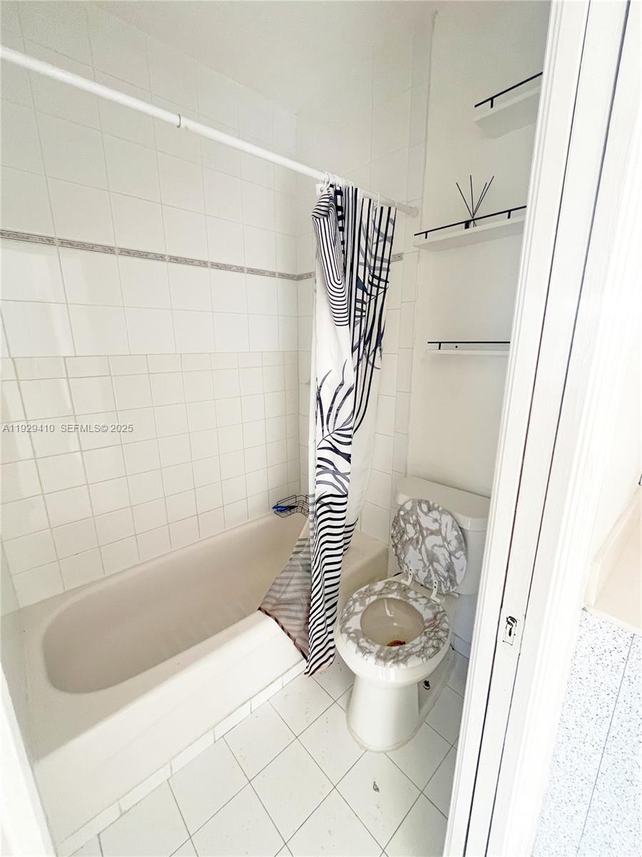220 East 4th Street, Unit 3 Hialeah, FL 33010 - Photo 14 of 22 a bathroom with a bathtub and shower