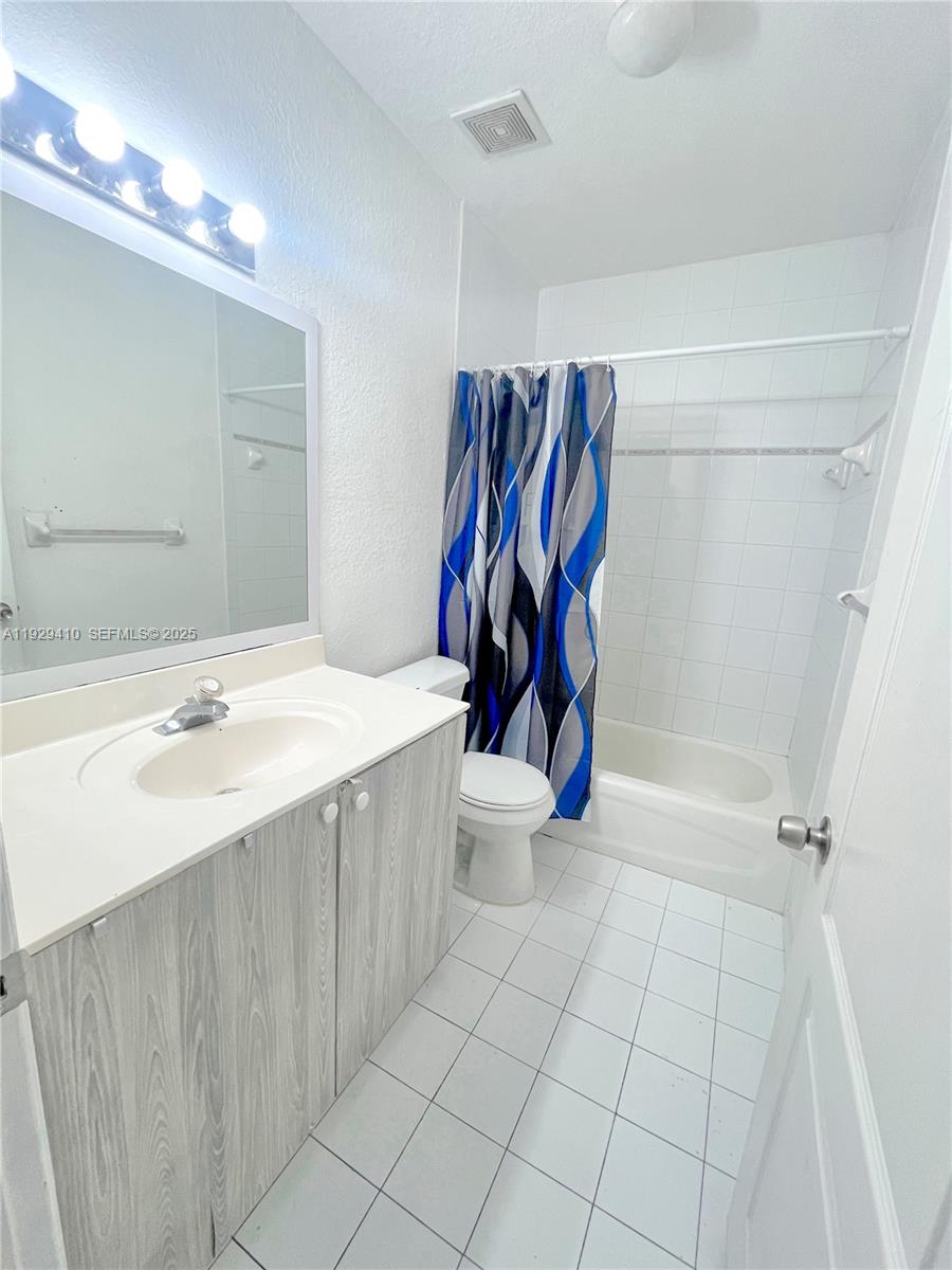 220 East 4th Street, Unit 3 Hialeah, FL 33010 - Photo 17 of 22 a bathroom with a sink toilet and shower