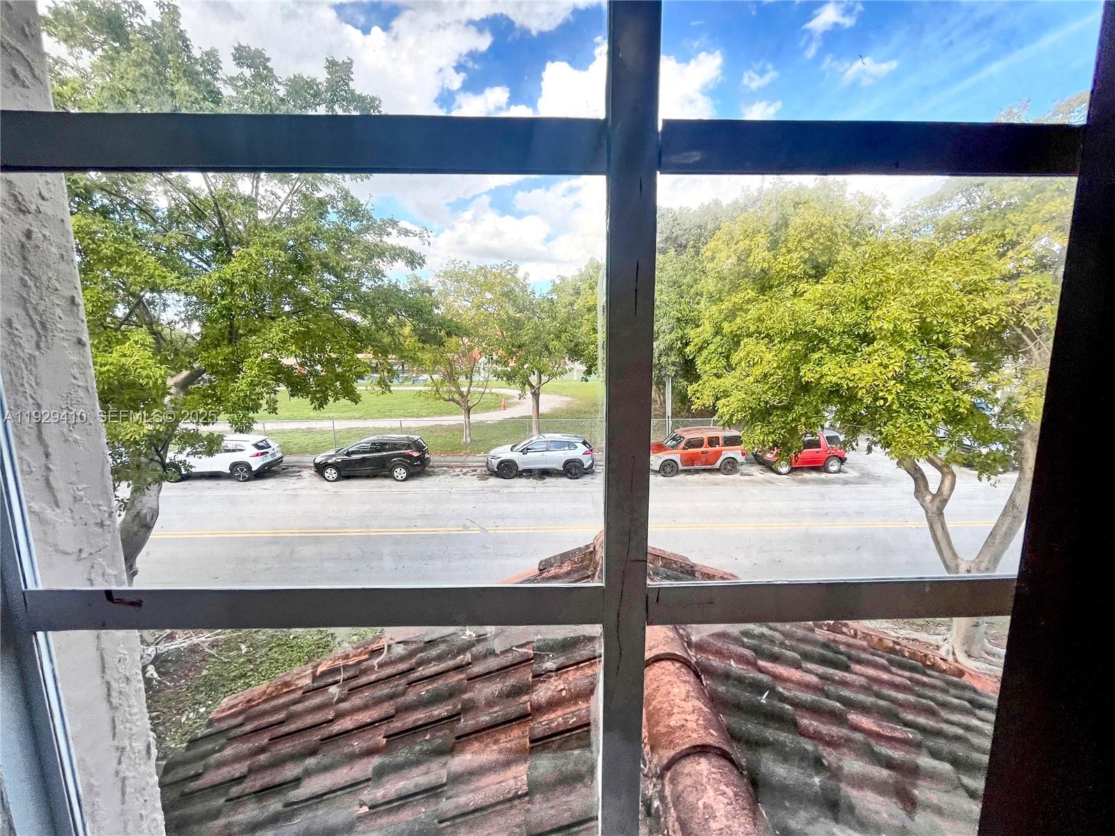 220 East 4th Street, Unit 3 Hialeah, FL 33010 - Photo 20 of 22 a view of a floor to a window with a tree in front of it