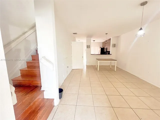 a view of a living room with a rug