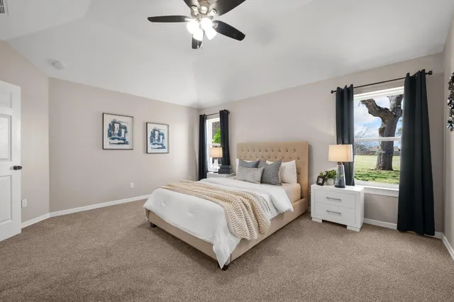 a bed room with a bed and a chandelier