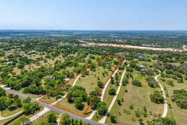 a bathroom with a granite countertop sink toilet a mirror and shower