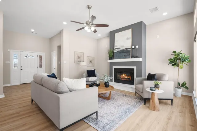 a living room with furniture and a fireplace