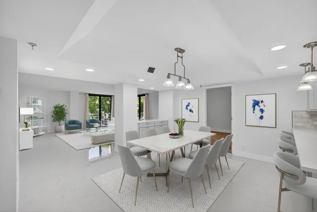 a view of a dining room with furniture and chandelier
