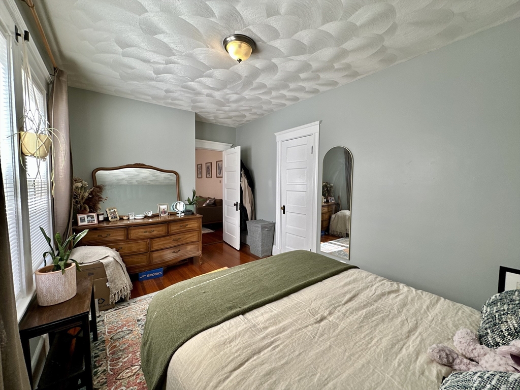 369 Centre Street, Unit 2 Boston, MA 02122 - Photo 11 of 16 a bedroom with a bed and a flat screen tv