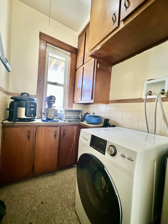 369 Centre Street, Unit 2 Boston, MA 02122 - Photo 13 of 16 a utility room with sink dryer and washer