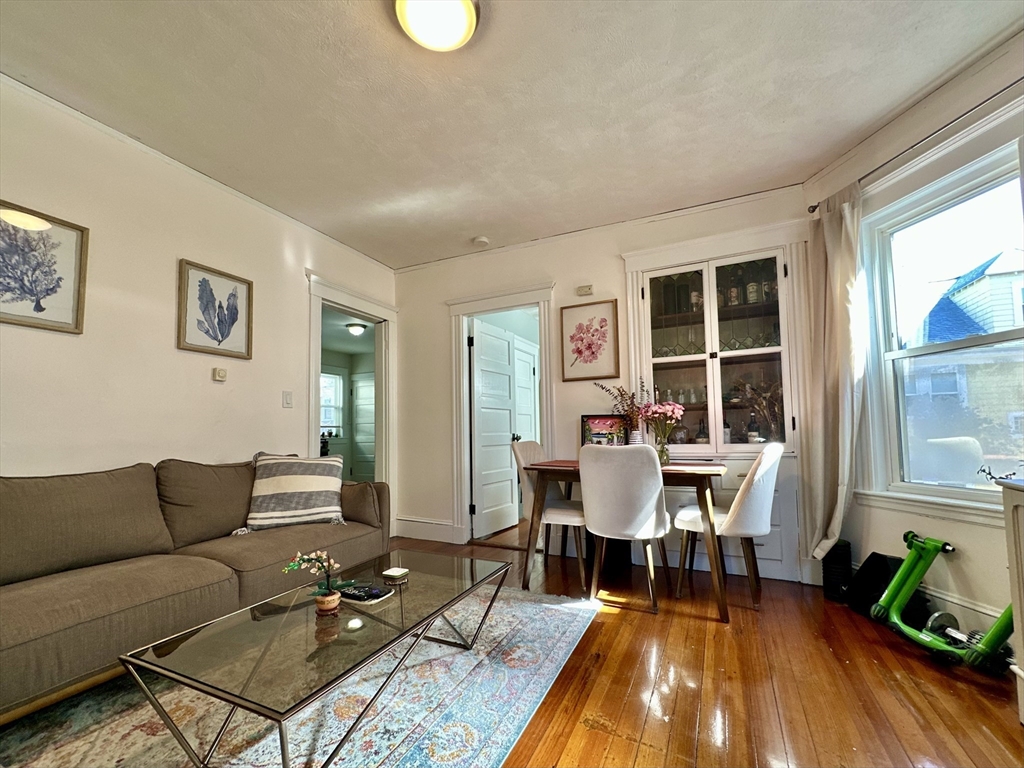 369 Centre Street, Unit 2 Boston, MA 02122 - Photo 9 of 16 a living room with furniture and a table