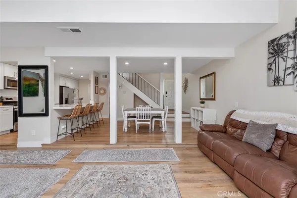 a living room with furniture and a rug