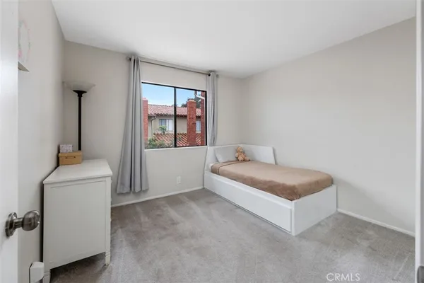 a room with a bed and a window