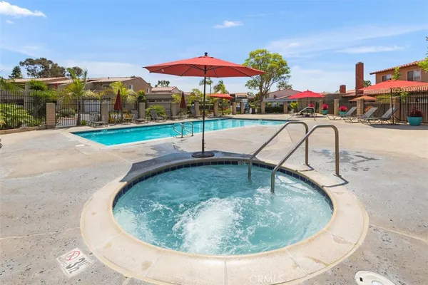a swimming pool with outdoor seating yard and barbeque oven