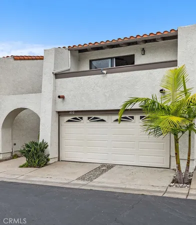 a view of front door and potted plants