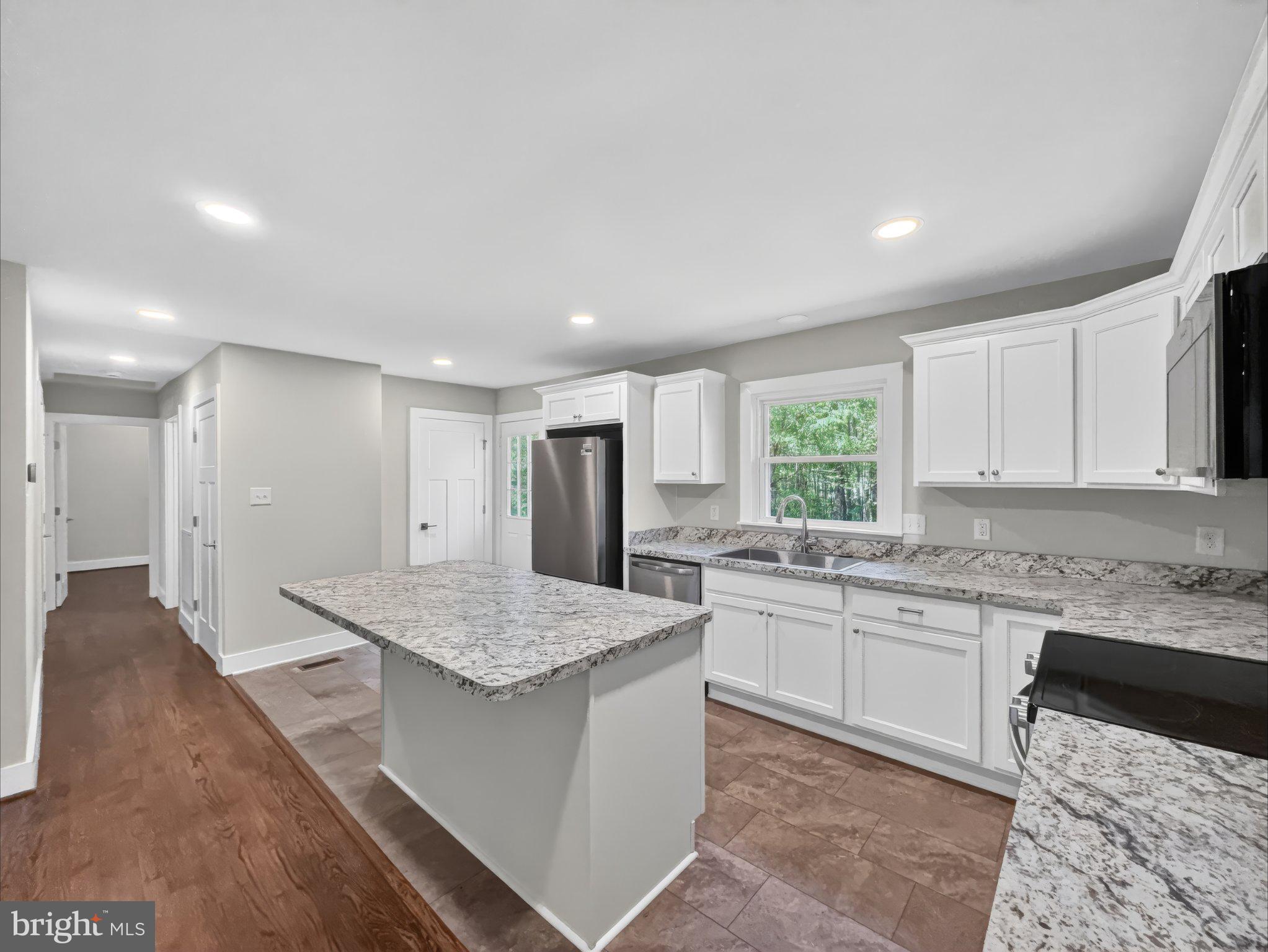 5408 Towles Mill Road Partlow, VA 22534 - Photo 15 of 24 a kitchen with a sink stove and refrigerator