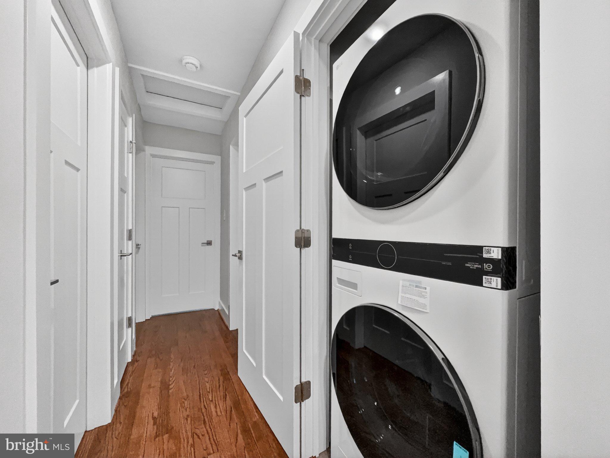 5408 Towles Mill Road Partlow, VA 22534 - Photo 17 of 24 a view of a hallway with washer and dryer