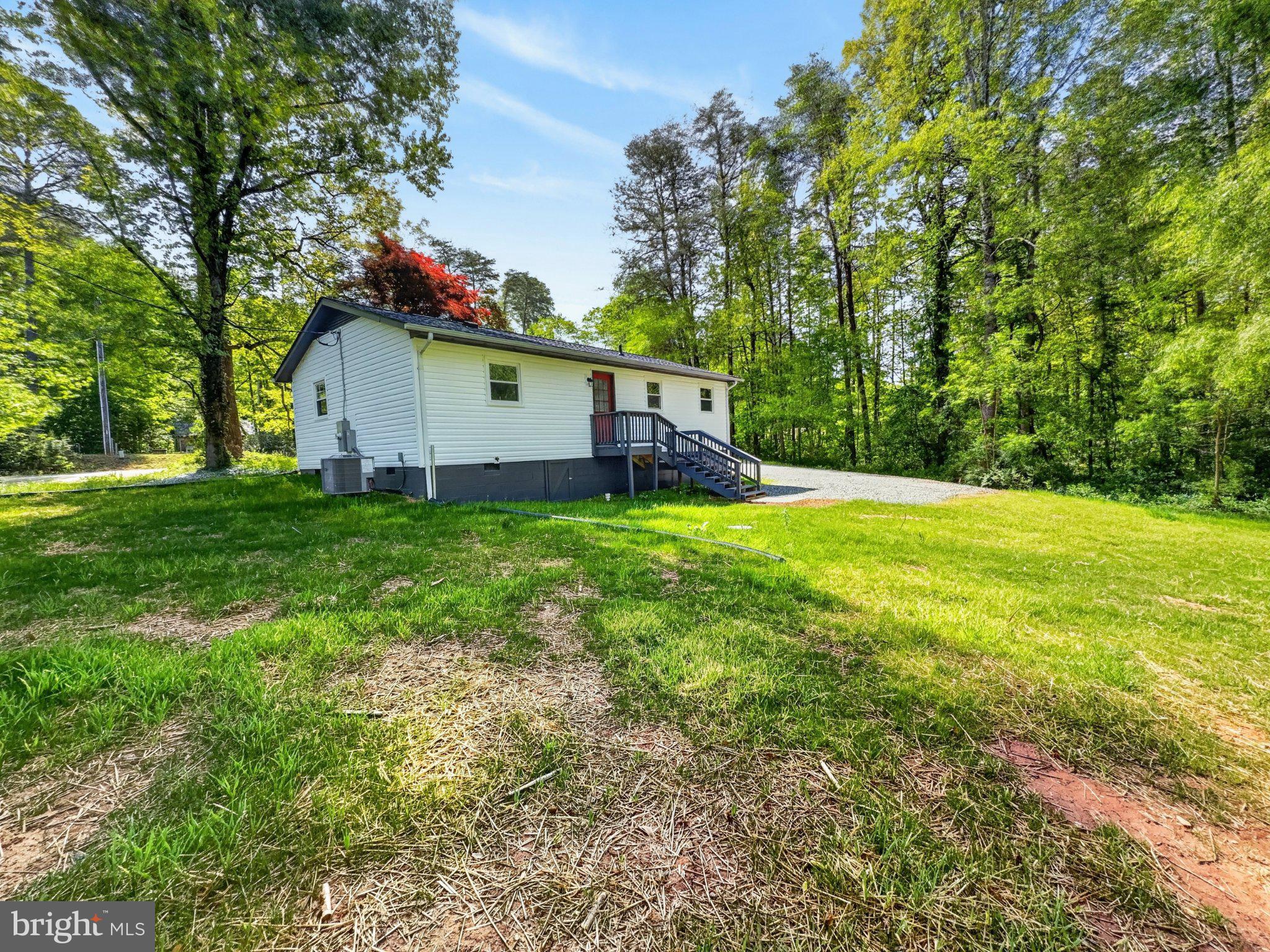 5408 Towles Mill Road Partlow, VA 22534 - Photo 23 of 24 a view of a house with a yard