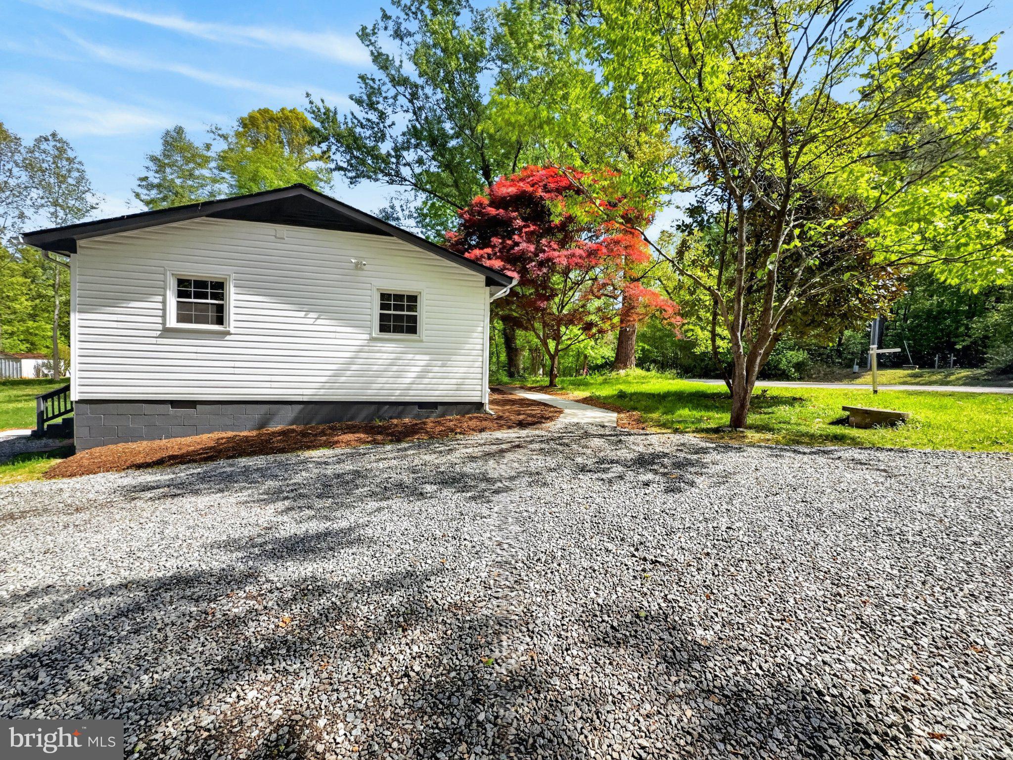 5408 Towles Mill Road Partlow, VA 22534 - Photo 6 of 24 a house view with a garden space