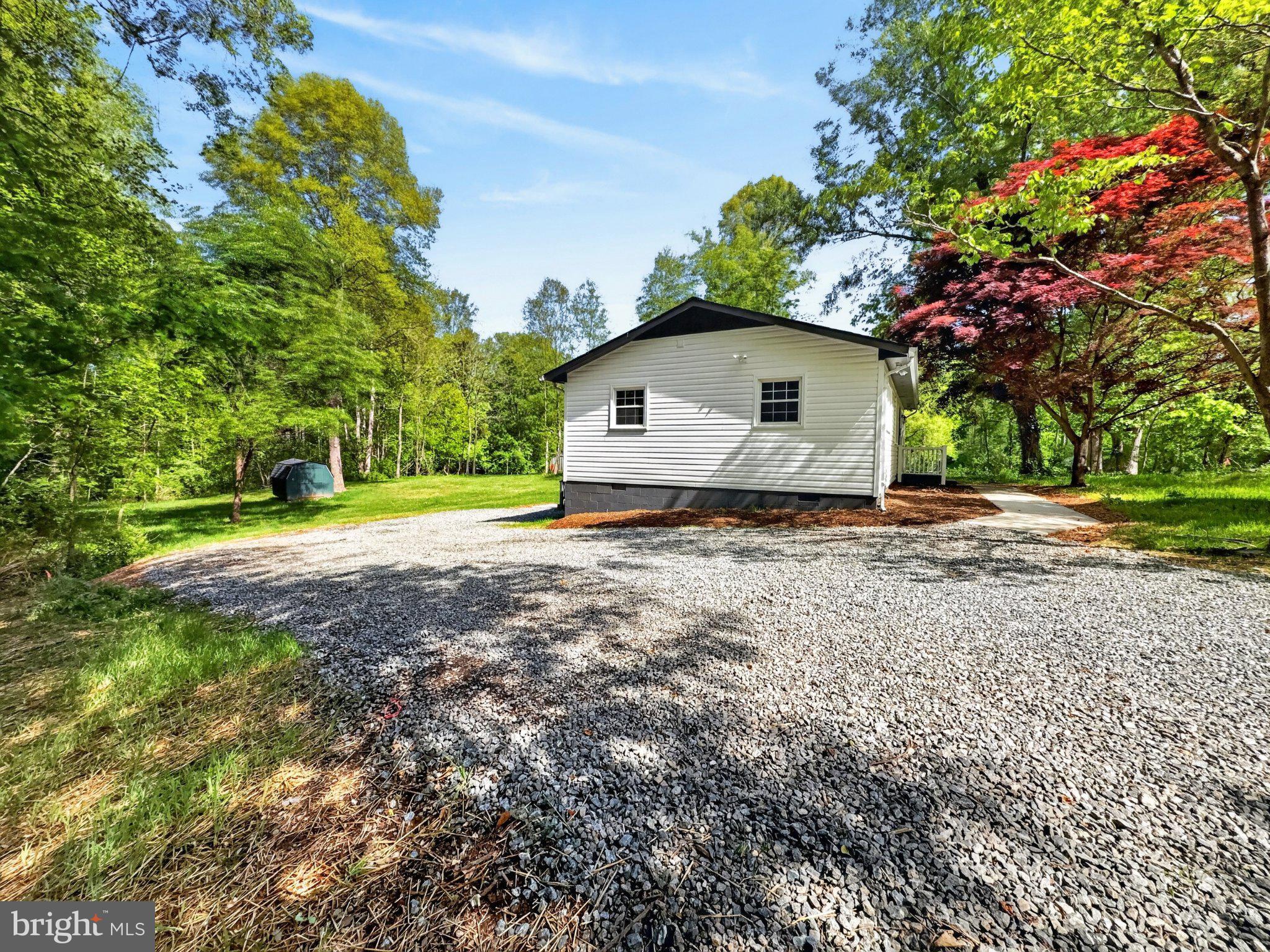 5408 Towles Mill Road Partlow, VA 22534 - Photo 7 of 24 a dirt road with a house in the background